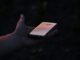 Person holding a smartphone for mobile communication. Photo by Fabian Hilzendecker on Unsplash.