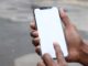 Man using a smartphone for mobile communication. Photo by Mediamodifier on Unsplash.