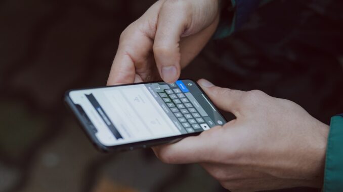 Smartphone being used for mobile data management. Photo by freestocks on Unsplash.