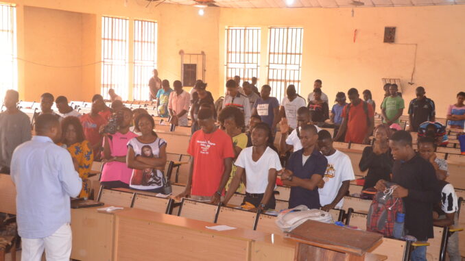Nigerian university students in a classroom during an orientation session